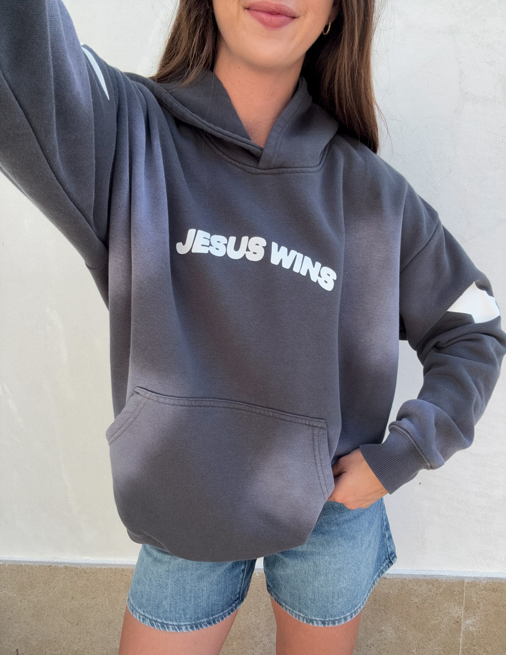 Unisex hoodie by Elevated Faith featuring Jesus Wins graphic design, soft fabric, and comfortable fit in a casual style.