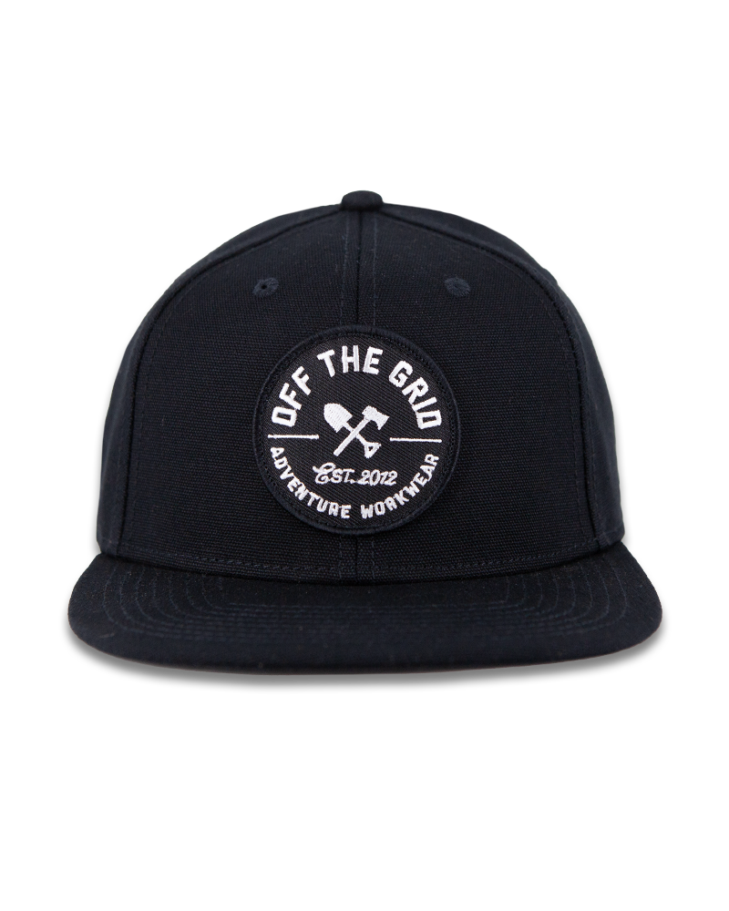 Black Off The Grid Surplus jobsite hat with adjustable strap and durable fabric, designed for outdoor work and protection.