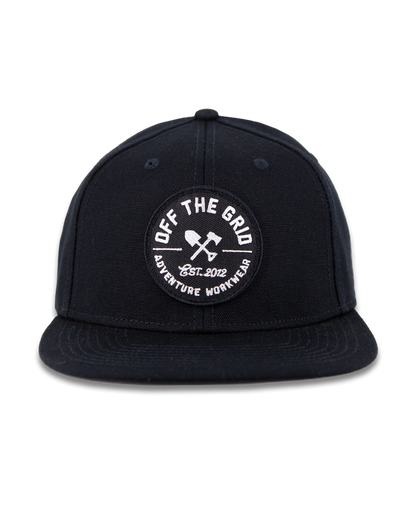 Black Off The Grid Surplus jobsite hat with adjustable strap and durable fabric, designed for outdoor work and protection.