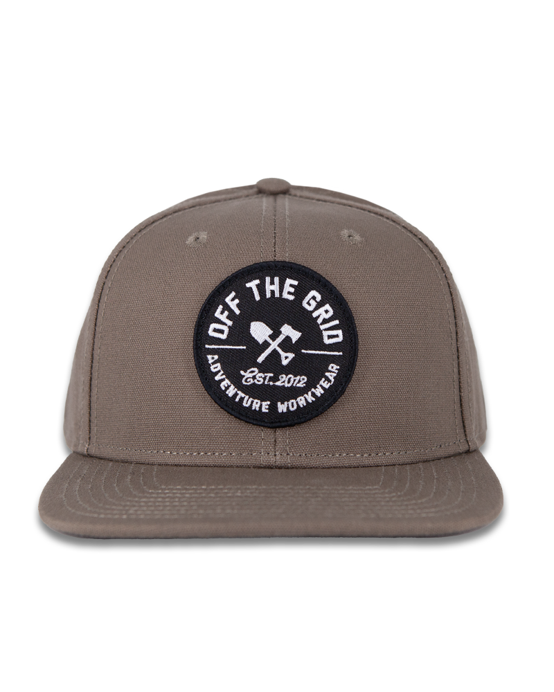 Off The Grid Surplus jobsite hat in walnut color, durable work hat with a wide brim and adjustable strap for outdoor use.