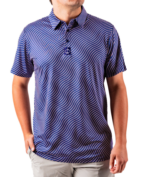 Men's Pins and Aces Wavy Stars and Stripes polo shirt with patriotic July 4th design, featuring wavy stars and stripes pattern.