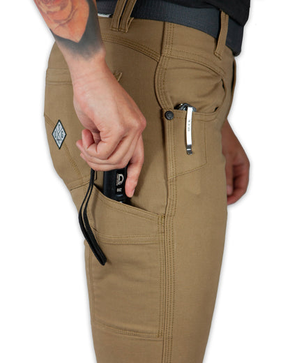 Women's Kestral pants in coyote color by Off The Grid Surplus, featuring a comfortable fit and outdoor-ready design.