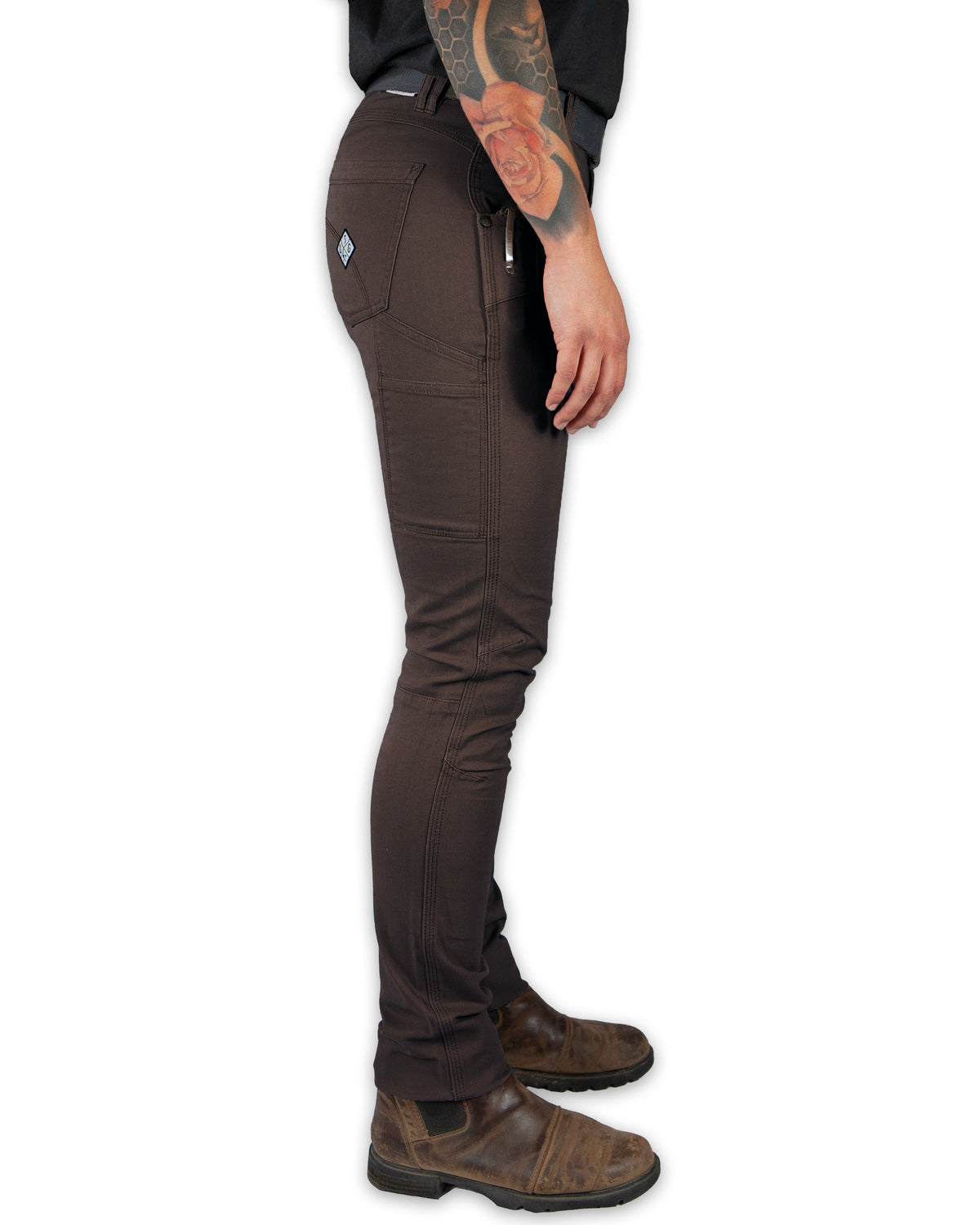 Dark brown Kestral women's pants by Off The Grid Surplus, showing the fitted waistband and relaxed fit fabric.