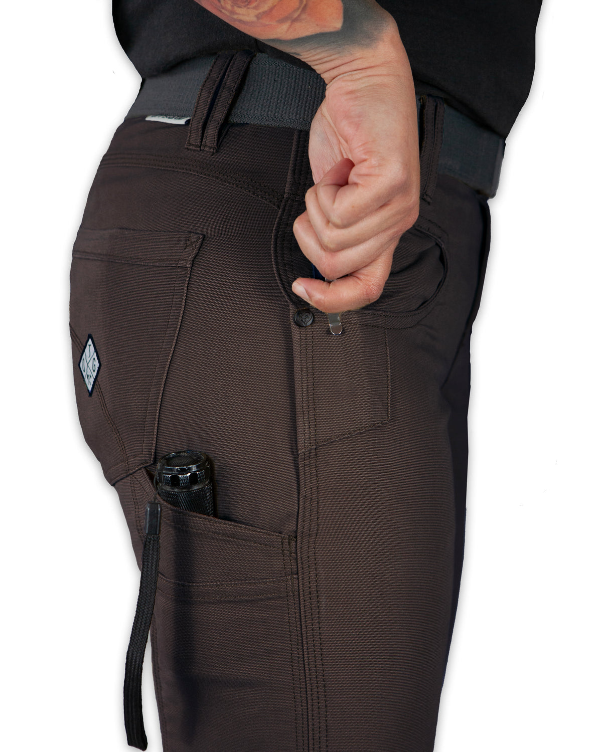 Dark brown Kestral women's pants from Off The Grid Surplus, shown with a relaxed fit and casual style.