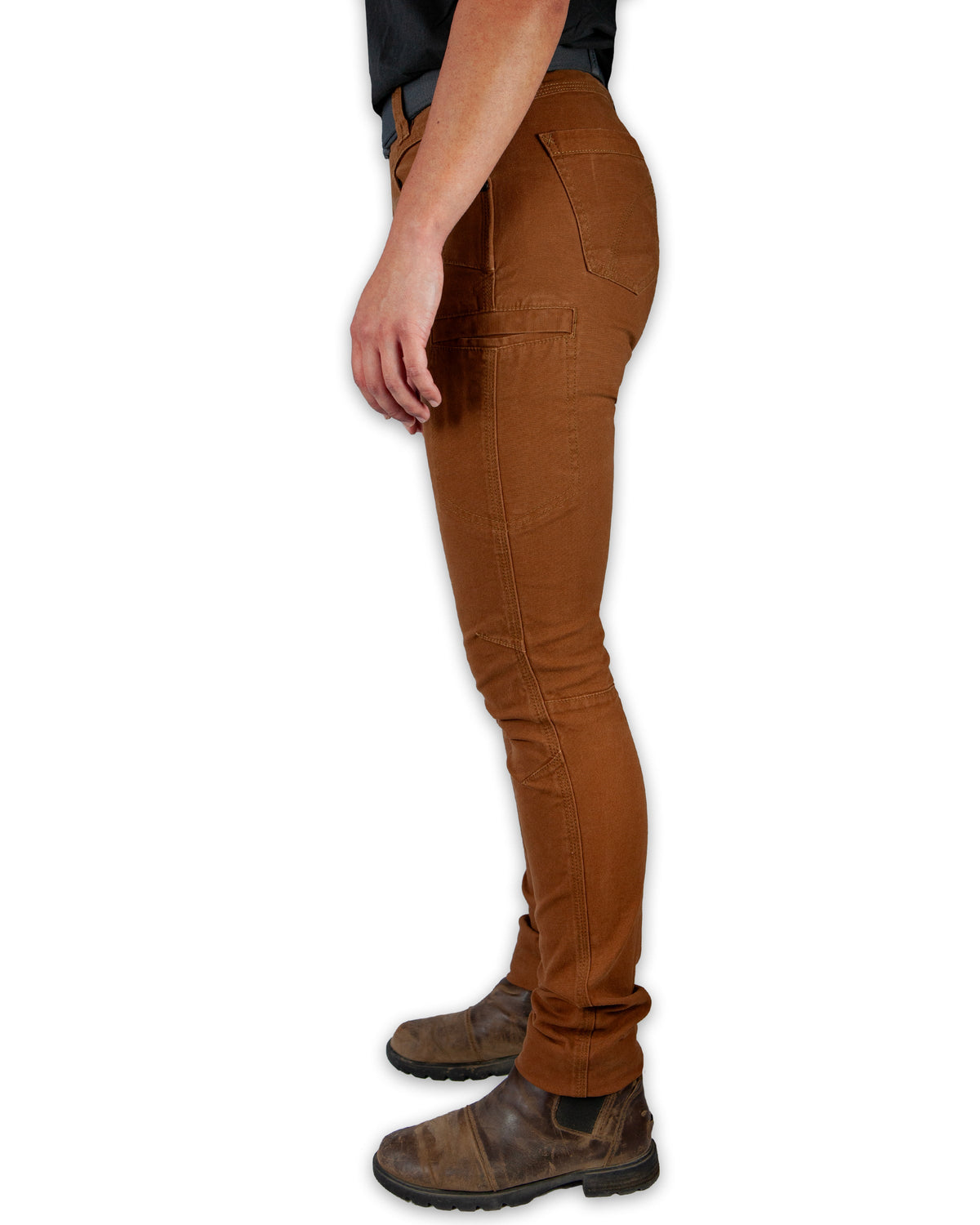 Kestral Women's Tobacco Pants by Off The Grid Surplus, showing the relaxed fit and sturdy fabric in a natural outdoor setting.