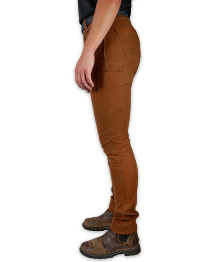 Kestral Women's Tobacco Pants by Off The Grid Surplus, showing the relaxed fit and sturdy fabric in a natural outdoor setting.