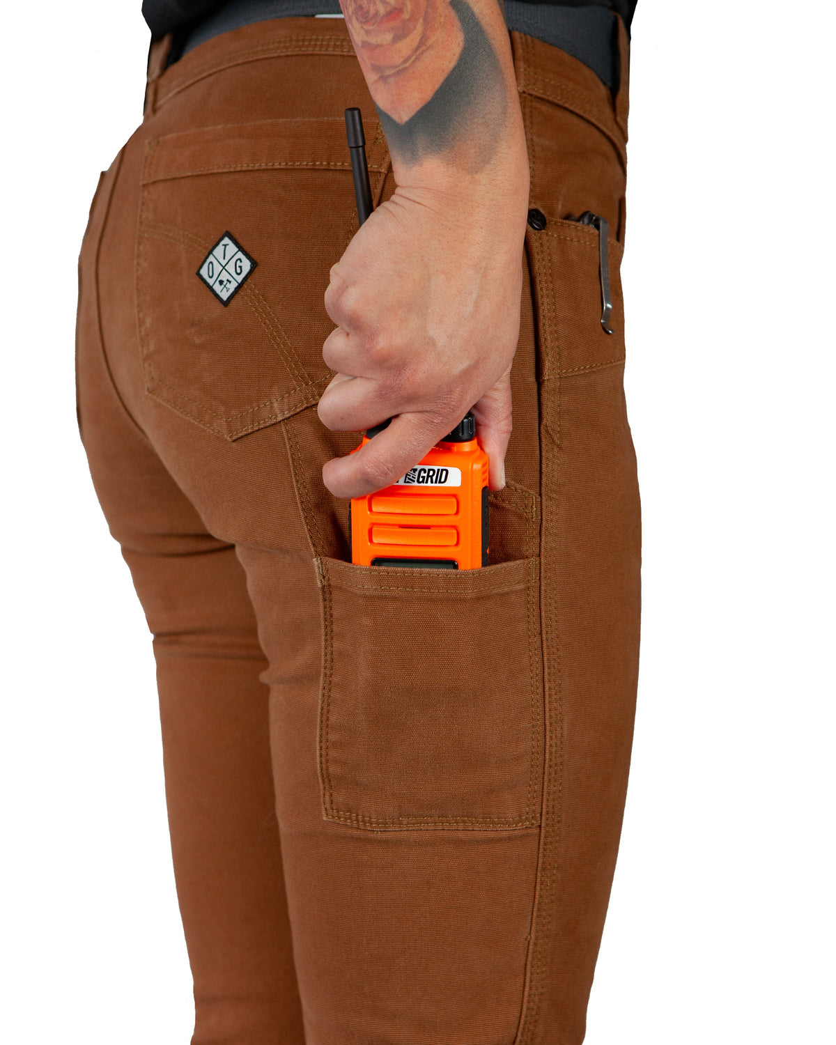 Kestral women's tobacco-colored pants by Off The Grid Surplus, featuring a relaxed fit and casual style, shown on a model.