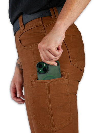 Kestral women's pants in tobacco color from Off The Grid Surplus, casual fit with front pockets and tapered leg design.