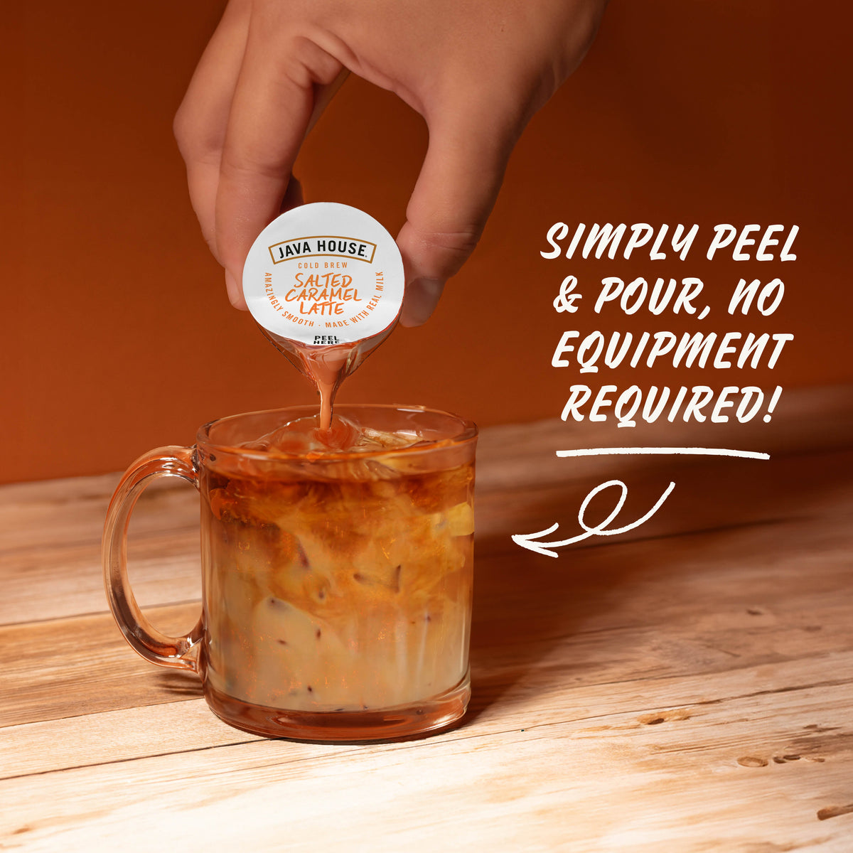Cold brew latte with salted caramel flavor from Java House, showing a glass filled with iced coffee topped with caramel drizzle