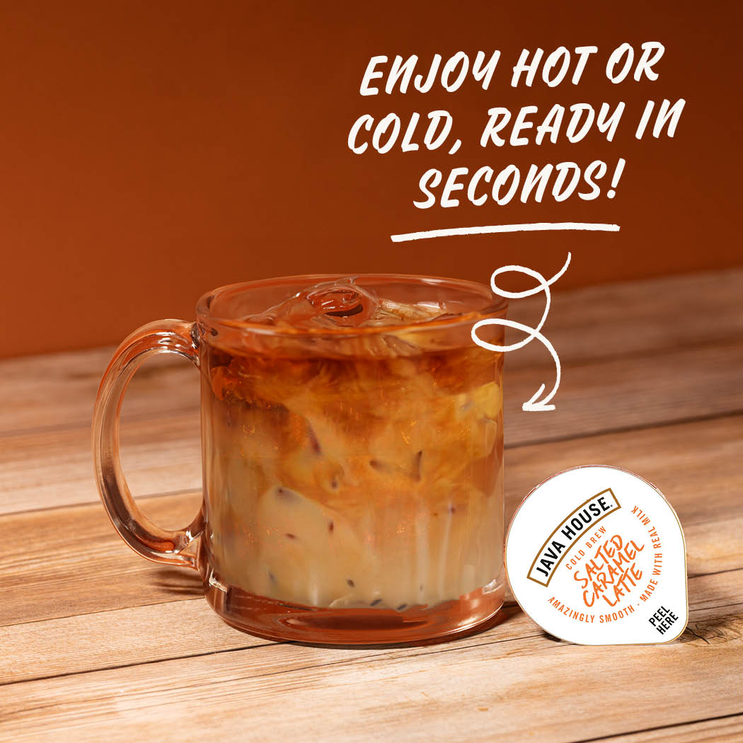 Cold brew latte with salted caramel from Java House, topped with whipped cream and caramel drizzle, in a clear glass.