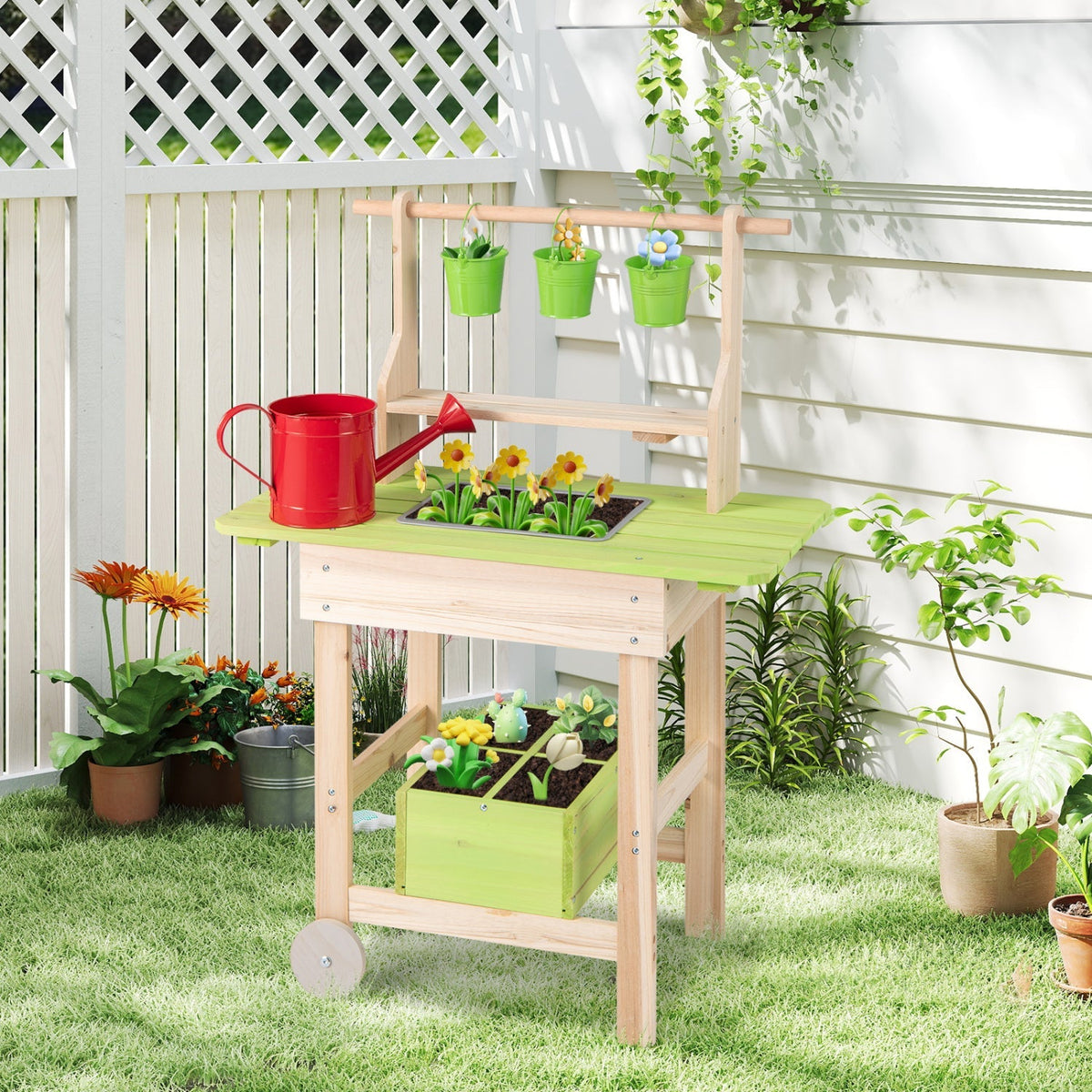 Kids mud play kitchen with removable pots, planting trough, and rustic wooden design for outdoor imaginative play.