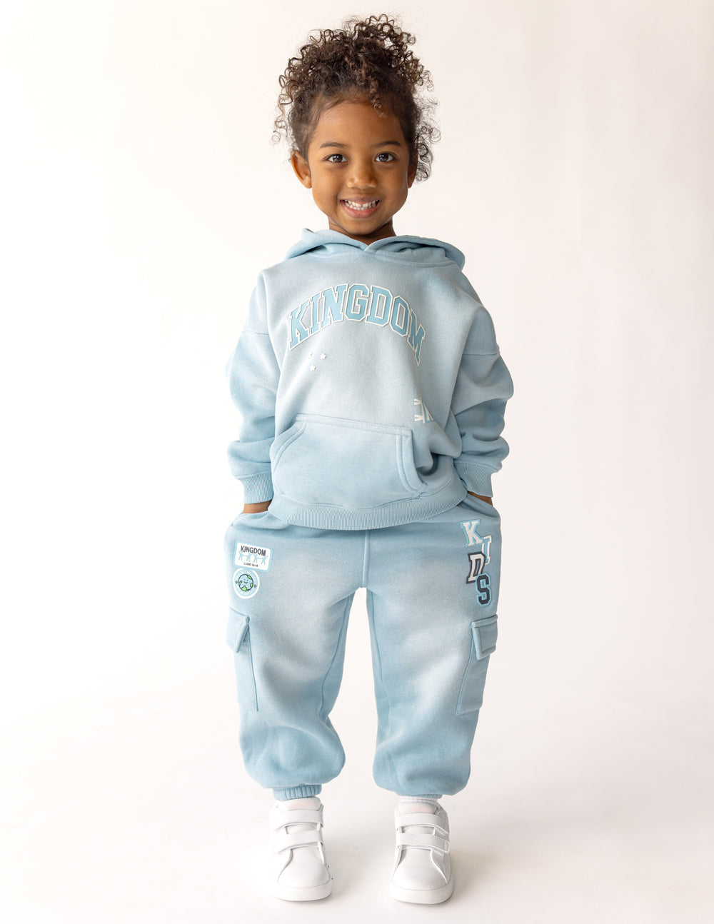 Kids cargo sweatpants by Elevated Faith with multiple pockets, made of soft, comfortable fabric for everyday wear.