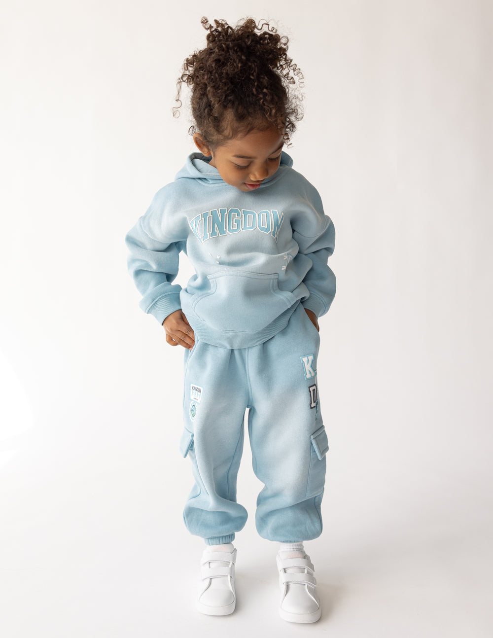 Kids cargo sweatpants by Elevated Faith featuring a comfortable fit and casual style, shown in a front view with pockets.
