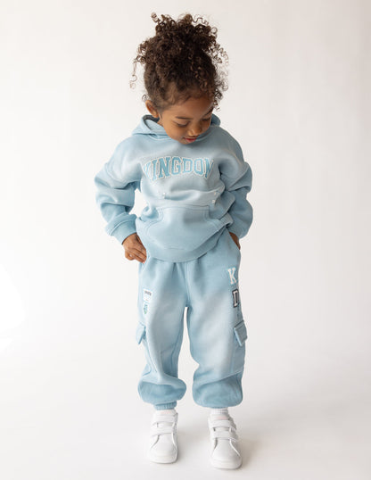 Kids cargo sweatpants by Elevated Faith featuring a comfortable fit and casual style, shown in a front view with pockets.