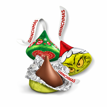 Hershey's Kisses Milk Chocolate Grinch candy in a bulk value bag, featuring festive green and white foil-wrapped chocolates.