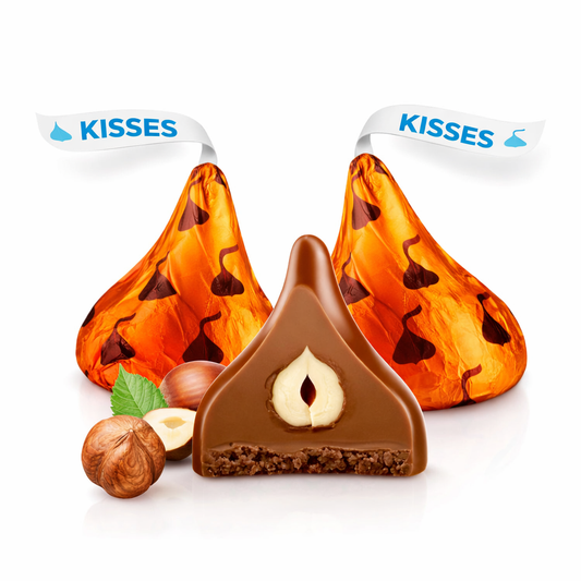 Hershey's Kisses Milk Chocolate with Hazelnuts in a bulk Candy In Bulk bag, showing shiny foil-wrapped chocolates with hazelnut filling.