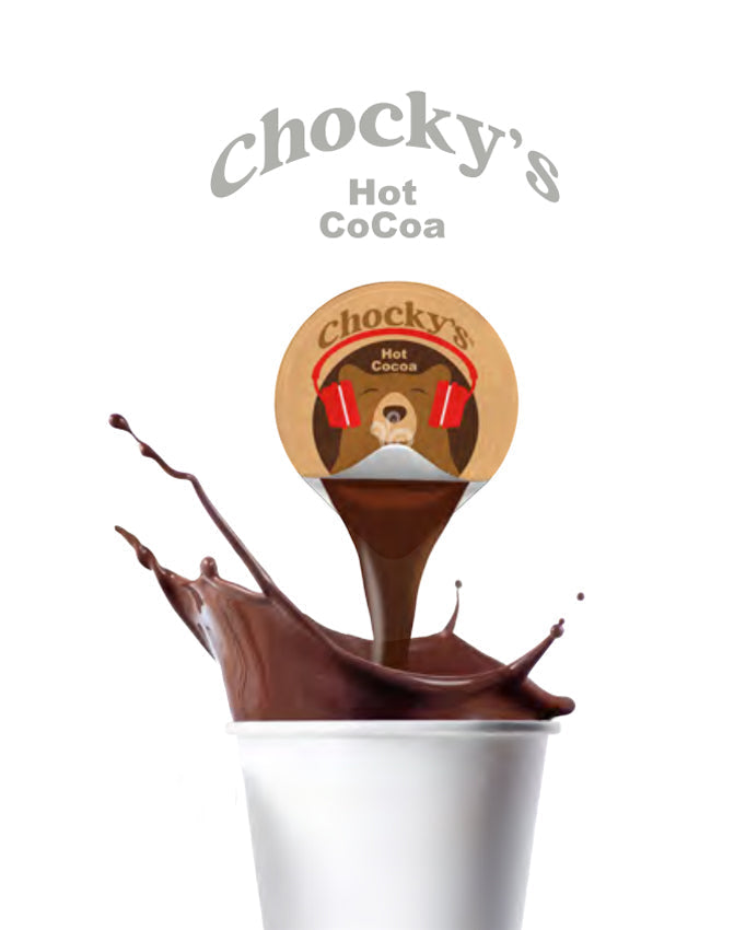 A jar of Java House Chocky's Hot Cocoa powder with a spoon and a mug of hot cocoa on a cozy table.