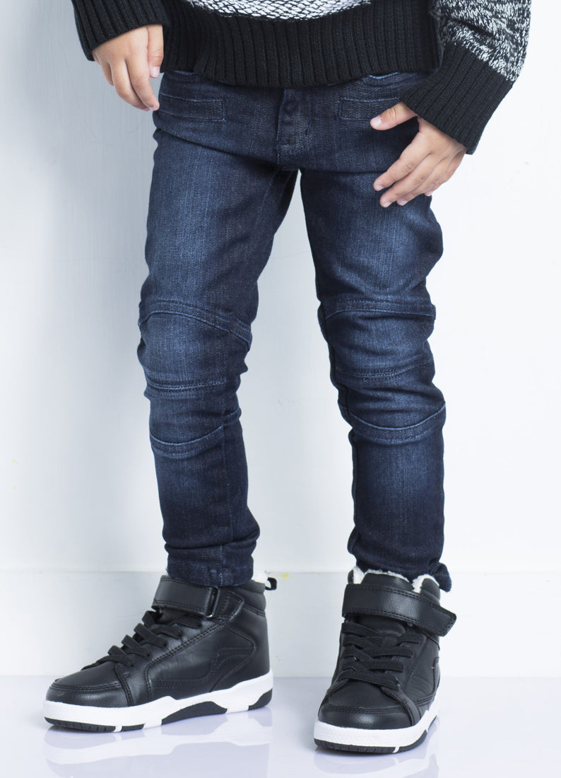 Dark biker jeans by IndigoPaper featuring a fitted design and classic denim look, shown on a model.