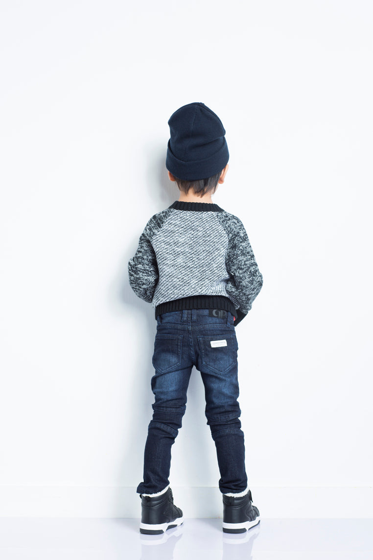 Dark denim biker jeans by IndigoPaper showing fitted silhouette and classic five-pocket design.