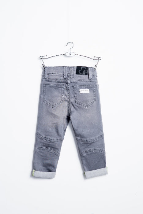 Grey biker jeans by IndigoPaper with distressed details and slim fit, shown on a model in a casual pose.