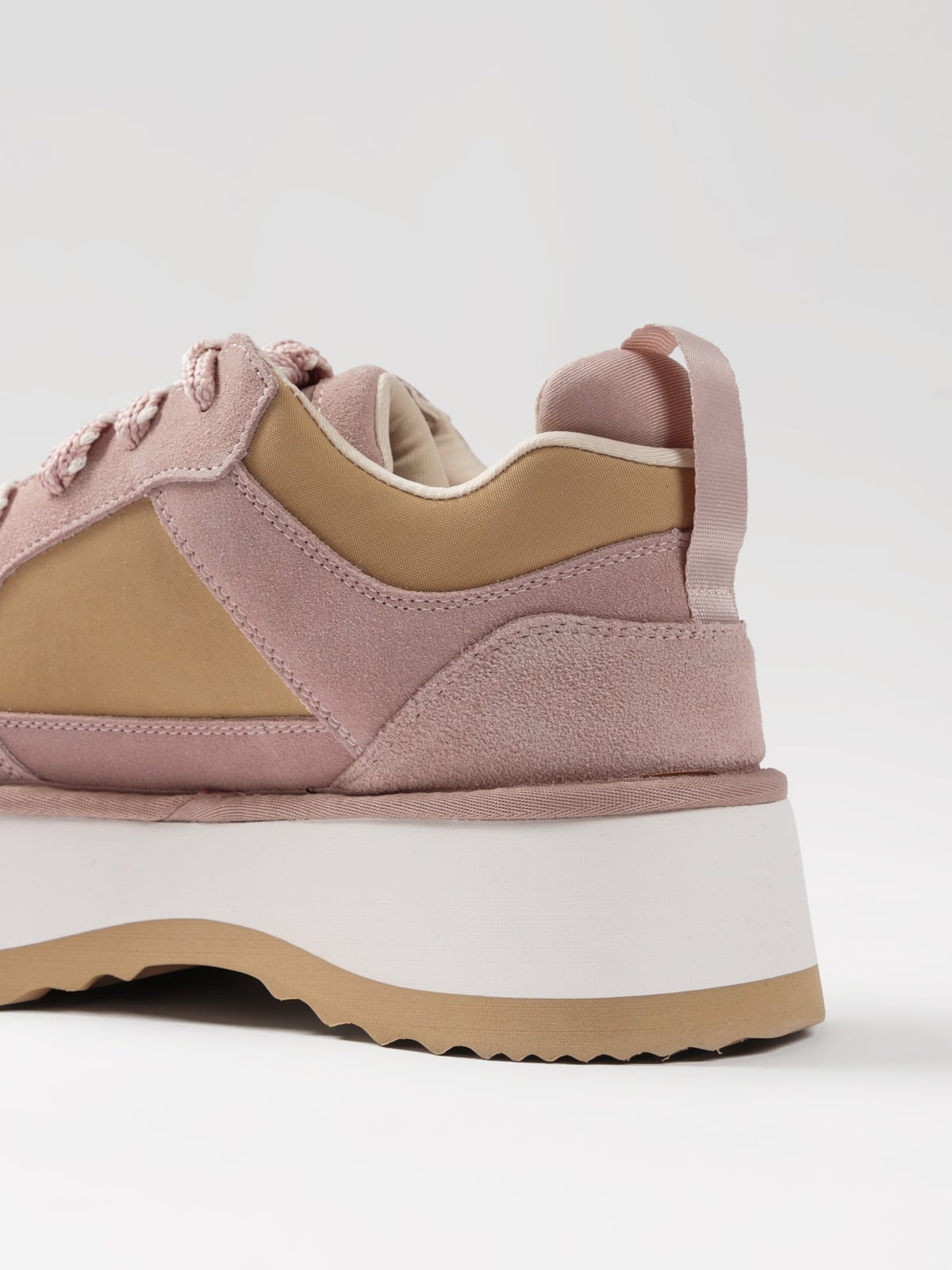 Pink women's casual footwear by L'ARTE MILANO, showing comfortable slip-on shoes with stylish design and textured sole.