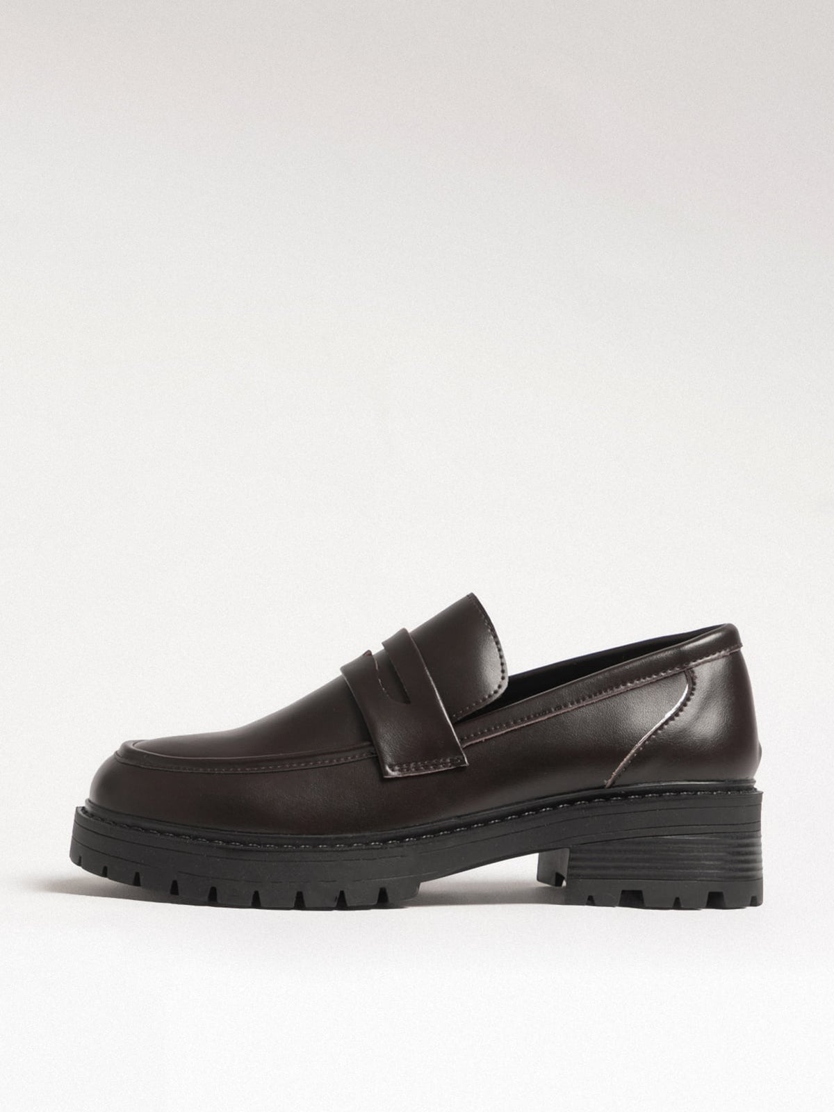 Women's leather footwear by L'ARTE MILANO featuring dark brown stylish shoes with sleek design and smooth leather finish.