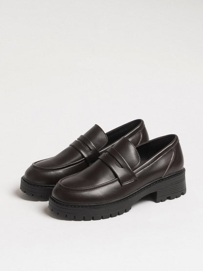 Women's leather footwear by L'ARTE MILANO featuring dark brown stylish shoes with a sleek design.