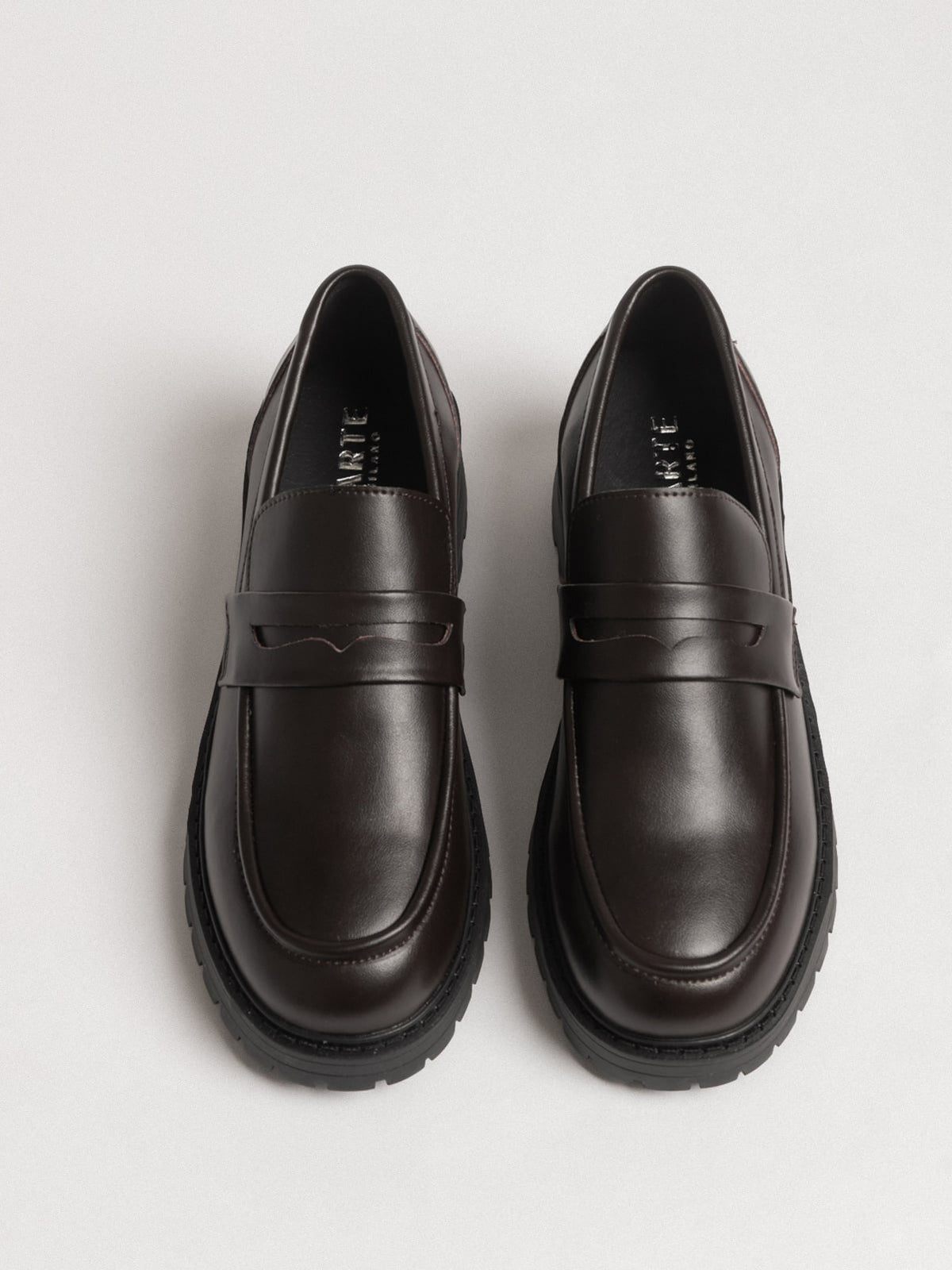 Women's leather footwear by L'ARTE MILANO featuring dark brown shoes with stylish design and polished finish.