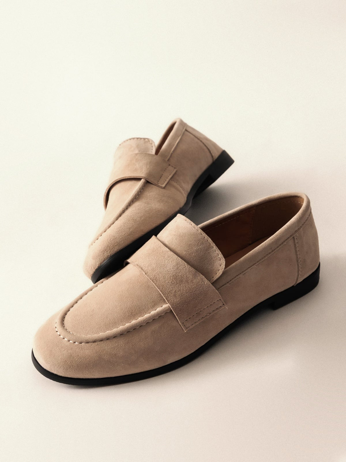 Women's leather shoes from L'ARTE MILANO featuring sleek design and neutral sand color, displayed on a clean background.