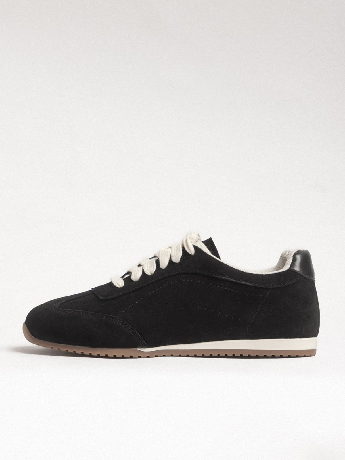 Black women's leather casual shoes by L'ARTE MILANO featuring a sleek, comfortable design with a rounded toe.
