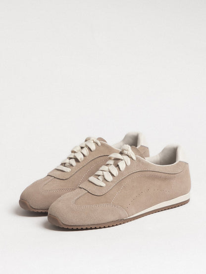 Women's leather casual shoes by L'ARTE MILANO, dark sand color, close-up of stylish footwear with stitching details.