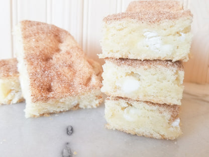 White chocolate snickerdoodle blondies from Let's Get Baked Artisan Desserts, showing creamy, golden dessert bars with cinnamon sugar topping.