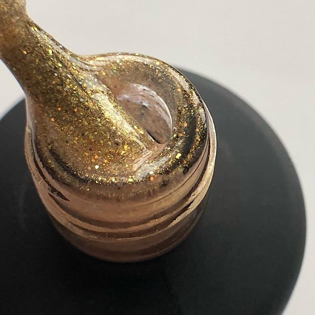 Luxio Sparkles Goddess gel nail polish in a 15ml bottle with shimmering, glittery finish and purple packaging.