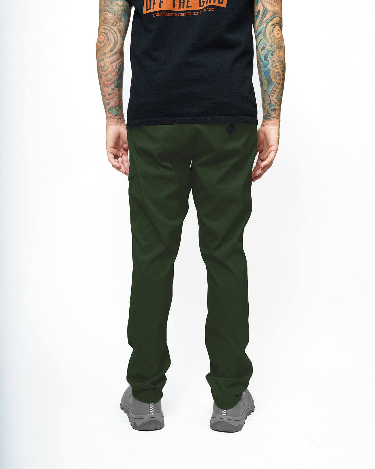 Dark army green taper fit pants by Off The Grid Surplus, featuring a modern style and comfortable fit.