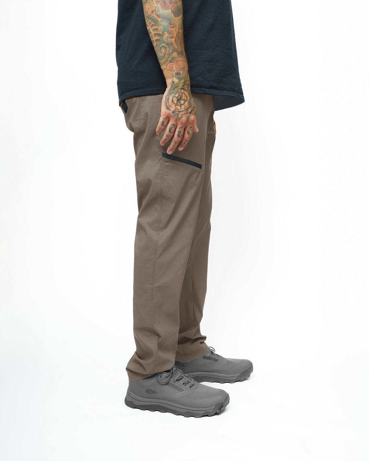 Off The Grid Surplus Lancer Taper Fit Pant in Deadwood color, showing the slim fit design and front pockets.