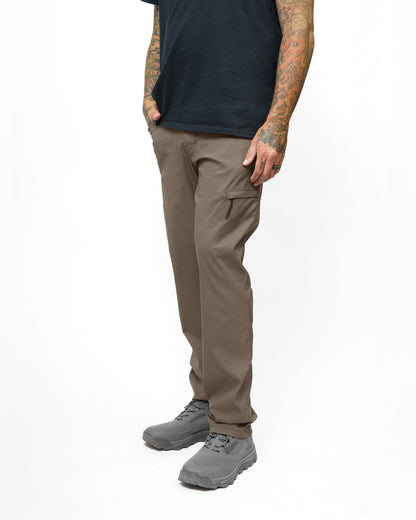 Off The Grid Surplus Lancer Taper Fit Pant in Deadwood with tapered design and rugged fabric, styled on a mannequin.