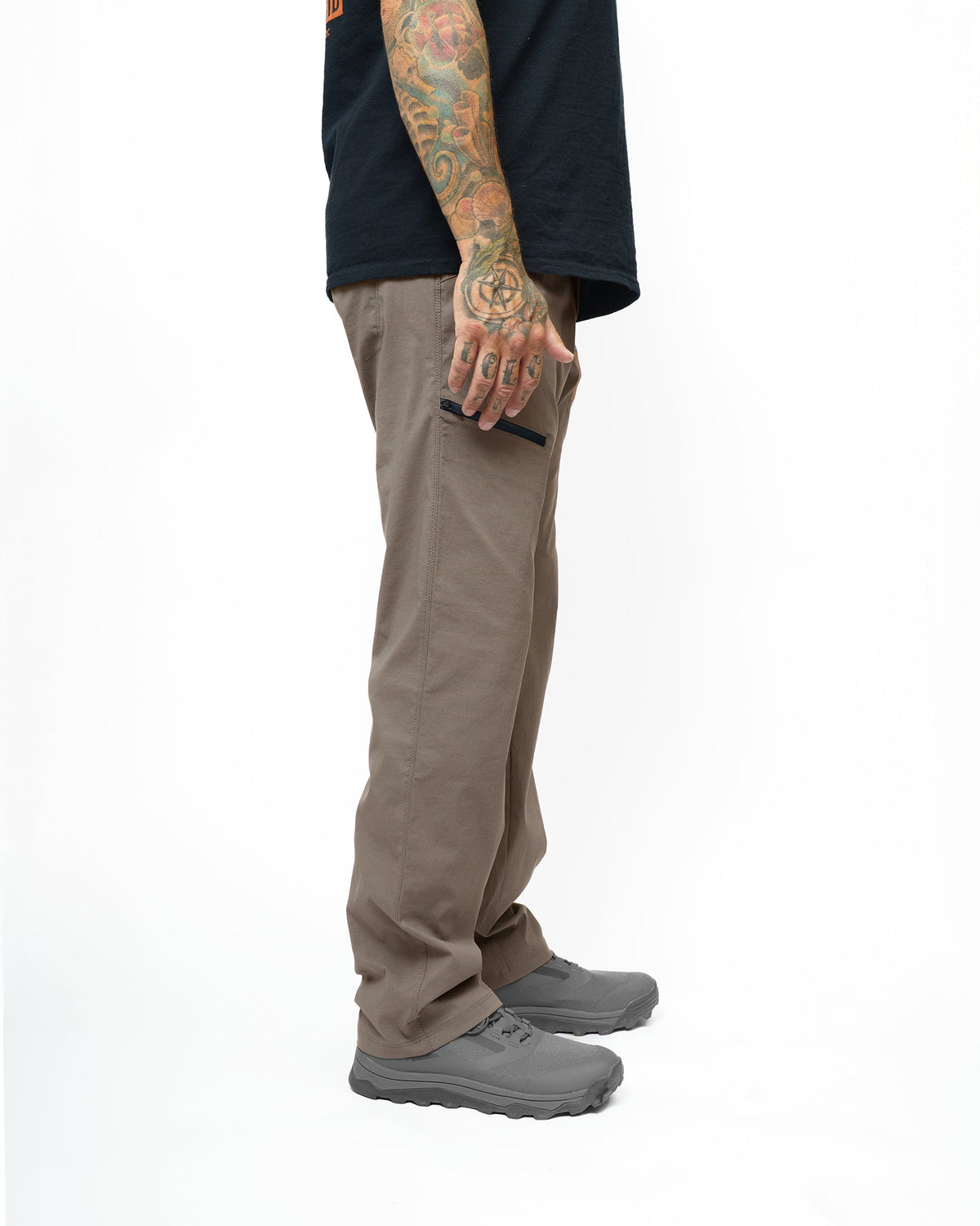 Off The Grid Surplus Lancer standard fit pants in Deadwood color, showing the relaxed fit and durable fabric design.
