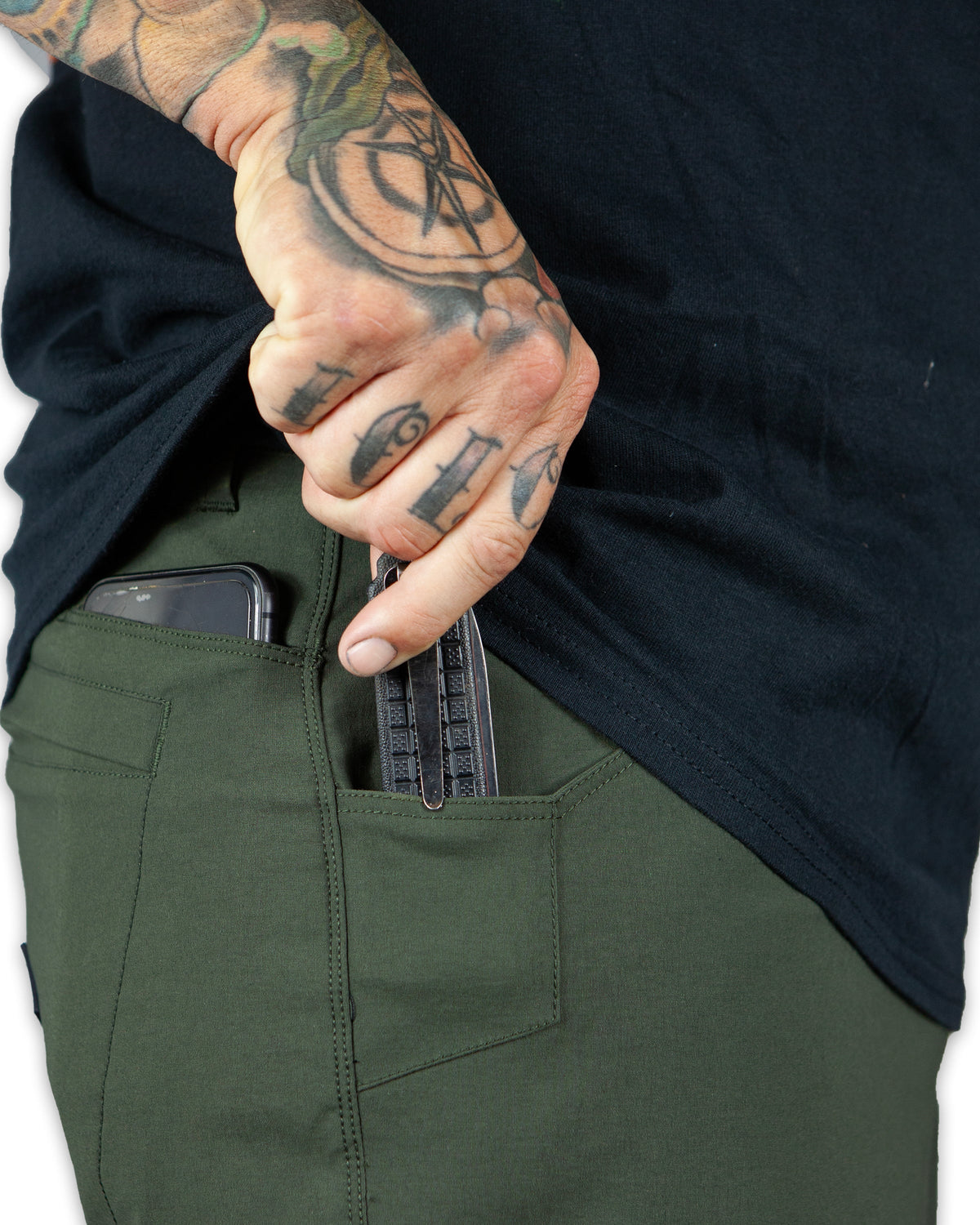 Dark army green Lancer standard fit pants by Off The Grid Surplus, shown with front pockets and belt loops.
