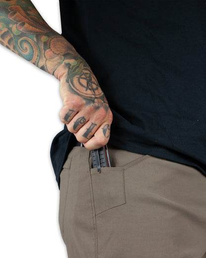 Off The Grid Surplus Lancer Taper Fit Pants in Deadwood color, showcasing slim tapered design with belt loops and front pockets.