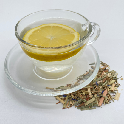Loose leaf herbal tea with lemongrass and ginger from Novel Tea Book Shop, showing fresh green lemongrass and ginger pieces.