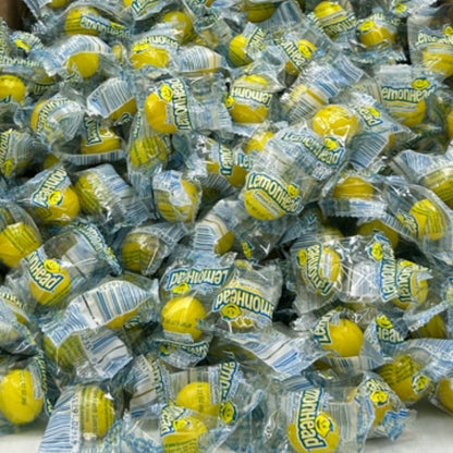 Lemonhead Original Lemon Hard Candy from Candy In Bulk in a bulk value bag, showing bright yellow lemon-flavored candies.