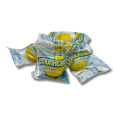 Lemonhead Original Lemon Hard Candy from Candy In Bulk in a bulk value bag, showing bright yellow lemon-shaped candies.