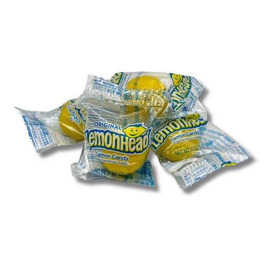 Lemonhead Original Lemon Hard Candy from Candy In Bulk in a bulk value bag, showing bright yellow lemon-shaped candies.