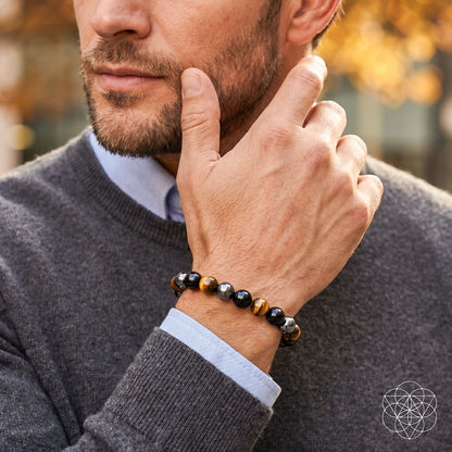 Conscious Items Triple Protection Bracelet worn on wrist, featuring layered black and silver beads in a stylish lifestyle setting.