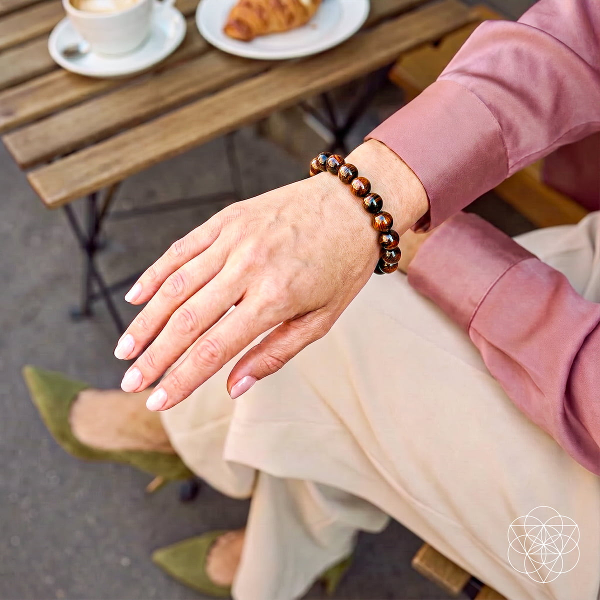 Mahogany Obsidian bracelet from Conscious Items featuring a stylish bracelet with natural stone beads on a lifestyle setting.