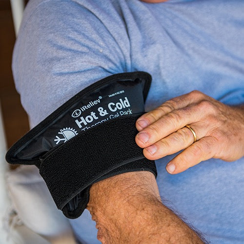 iReliev premium reusable hot and cold therapy gel pack with securement straps in a lifestyle setting for pain relief.