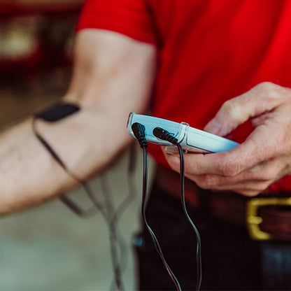 iReliev extra long TENS lead wires attached to TENS unit, showcasing durable accessories for pain relief therapy.