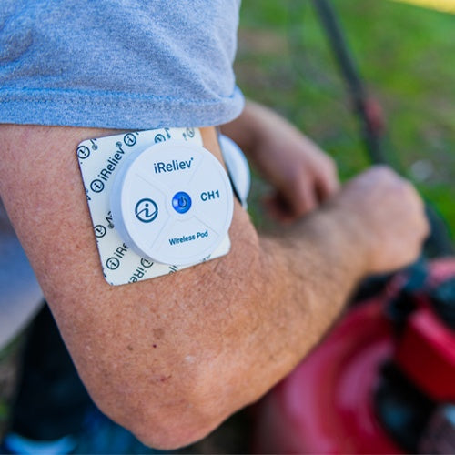 iReliev wireless small pads refill kit for TENS and EMS devices, shown in a lifestyle setting with replacement pads.