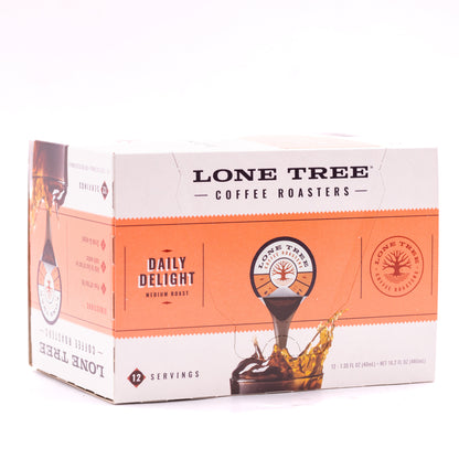 Medium roast coffee beans from Lone Tree Coffee Roasters' Daily Delight blend by Java House, displayed in a rustic bag.