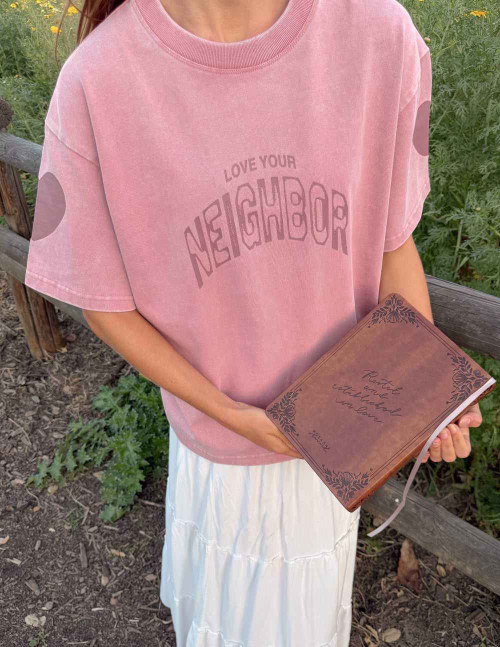 Elevated Faith Love Your Neighbor heavyweight T-shirt featuring bold text and comfortable fabric for casual wear.